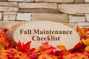 F.J. Murphy & Son, Inc.—Fall leaves next to a stone building in Springfield, IL, with the words “Fall Maintenance Checklist.”