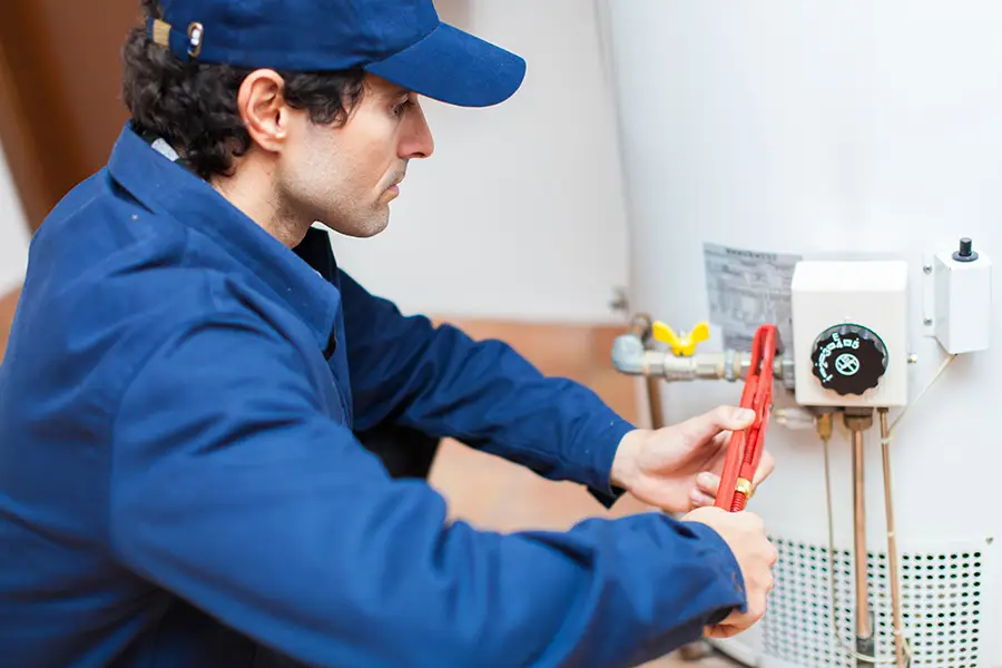 F.J. Murphy & Son, Inc.—A plumber fixes a hot water heater in a home in Springfield, IL